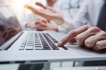 Wall Mural - Male hands or men office worker typing on the keyboard