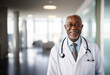 © Panuwat - Portrait of a african american seniro doctor on blurred hospital or health care center