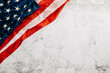 Vintage American flag for Veteran's Day, a symbol of honor, unity, and pride. Stars, stripes, and government in the USA symbolize patriotic glory. isolated on cement background