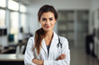 © Margo_Alexa - young smiling doctor in a robe in the clinic .