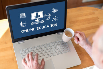 Wall Mural - Online education concept on a laptop