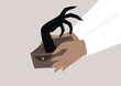 © nadia_snopek - Person opening a wallet, with a large black monstrous hand emerging from it, symbolizing the fear of financial strain or credit debt.