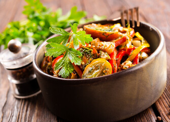 Wall Mural - Fresh colorful spring vegetable salad with cherry tomatoes and sweet peppers in the bowl.