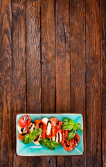 Wall Mural - Caprese salad with mozzarella cheese, tomatoes and basil. Typical Italian cuisine