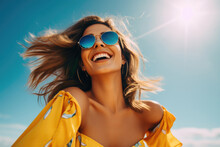 A Young Woman In Sunglasses Laughs Against The Background Of The Sky And Sun