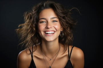 Poster - Portrait of a Caucasian brunette woman in casual clothes on dark gray background