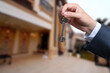 © Oleksandr - Man hand holding on finger keys to new house.