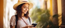 Happy female tourist using mobile maps outdoors to locate city attractions while traveling