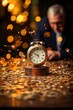 © Photo Designer 4k - Businessman with an alarm clock and coins on top of a stack of gold