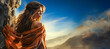 Beautiful desert woman watching swirling sand in intense blue sky.