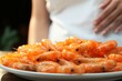 Shrimp consumption triggers allergic reactions in women, leading to various symptoms