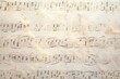 An antique sheet of music with handwritten notes. Perfect for music enthusiasts or vintage-inspired designs.