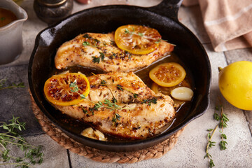 Wall Mural - Chicken breast meat fillet roasted with thyme, lemon and mustard sauce. Delicious homemade poultry dish