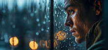 A Young Men Looking Through A Rainy Window With Tears Streaking Down, Concept Of Loneliness And Depression, Copy Space 