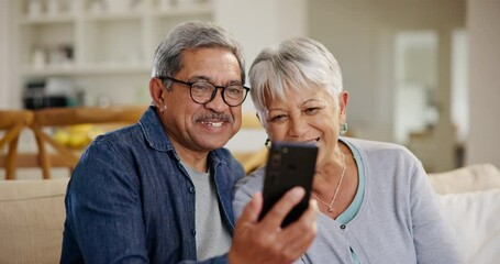 Canvas Print - Senior couple, smartphone and video call with wave, conversation and living room couch. Grandparents, technology and communication with family, man and woman in retirement, happiness and connection