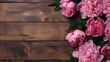 space for text on wooden background surrounded by Peony flowers from top view, background image, AI generated