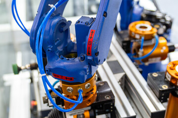 Sticker - robot arm working in car factory