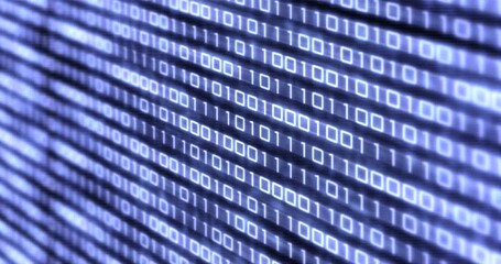 Stream of digital binary data on screen. Shallow depth of field.