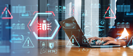 Man hands with laptop and cybersecurity bug interface