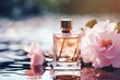 Close-up view of perfume bottle on water background with flowers