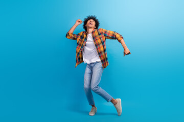 Poster - Full length photo of funky excited guy dressed checkered shirt dancing having fun empty space isolated blue color background