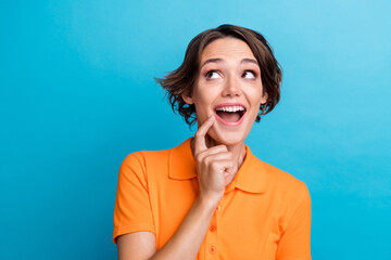 Sticker - Photo of adorable excited lady wear orange t-shirt finger open mouth looking empty space isolated blue color background