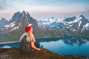 Wall Mural - woman tourist hiking in norway outdoor active girl traveling with backpack healthy lifestyle in moun