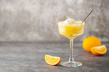 Wall Mural - Homemade orange creamsicle in glass. Frozen orange juice with ice cream. Summer dessert. Copy space