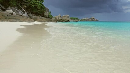 Wall Mural - landscape with white sand beach and storm sky on similan islands, thailand, 4k