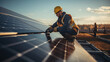 © Hasanka - Male engineer in uniform walking and looking at solar power plant. Man in hard helmet examining object. Concept of solar station development and green energy. Worker on solar power station outdo