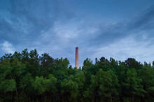 A 750-foot Smokestack Rises Over The Trees At Georgia Power's Plant Hammond In Rome, Georgia.