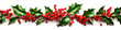 Christmas decoration garland from holly berries and leaves, with red ribbon on white background. Winter festive nature concept. banner