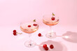 Modern still life with rose wine, alcoholic cocktail and cherry berries on elegant modern background, minimal concept for bar and holiday party, cafe, advertising banner, selective focus,