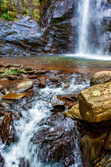 Wall Mural - Waterfall, lake and river among the rocks of the rainforest in Minas Gerais, Brazil