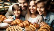 Close-up photo of a family consisting of a father, mother, and two children, eagerly choosing pastries from a display.