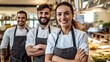 Smiling Team of Chefs Ready to Work in a Restaurant Kitchen