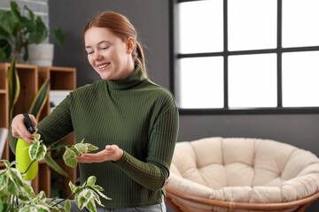 Sticker - Young woman watering plant at home