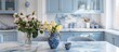 © The 2R Artificiality - Provence style apartment with a marble countertop adorned by vases and flowers The kitchen island and dining table are set with tableware The classic interior design room features blue furn