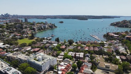 Wall Mural - Aerial drone view of homes and streets above the harbourside suburb of Double Bay in east Sydney, NSW Australia looking toward Sydney Harbour on a sunny day