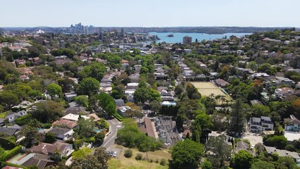 Wall Mural - Aerial drone descending view above the harbourside suburb of Double Bay in east Sydney, NSW Australia looking toward Sydney Harbour on a sunny day