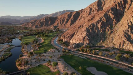 Wall Mural - Sunrise aerial view of La Quinta mountains, surrounded by golf courses and resort communities