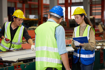 engineers or workers meeting and talking about work or project in the factory