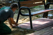 Installation of a park bench for paving stones in a designated place in the city park.