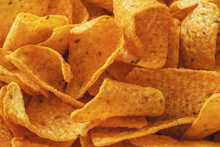 Close-up Of A Stack Of Cheese-flavored Corn Chips
