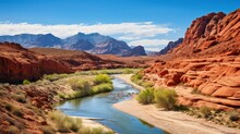 A Rugged, Red Rock Canyon With A Winding River