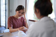 © snowing12 - Asian psychologist women holding hand to encouraging patient and giving counseling about mental health therapy in clinic while female patient stress and anxiety with psychological health problem