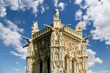 Saint-Jacques Tower (Tour Saint-Jacques) against the background of a beautiful sky with clouds. Located on Rivoli street, Paris, France. This 52 m Flamboyant Gothic tower (XVI century)