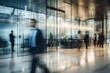 © Simon - Businesspeople walking at modern office with motion blur effect.