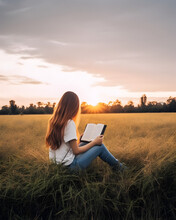 Beautiful Girl Reading Bible Book In The Field.