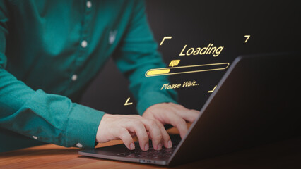 Concept of waiting for load of loading symbol. User man using a laptop computer for download and update software and waiting to loading digital file data form website, very slow internet form wifi.